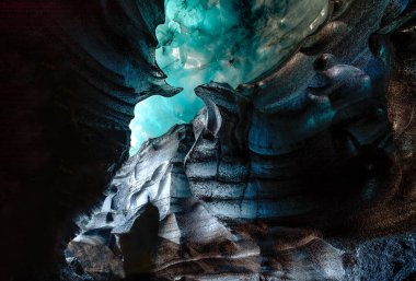 Blue crystal ice cave, underground beneath the glacier in Iceland clipart
