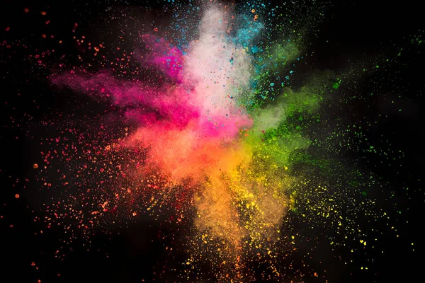 Launched colorful powder on black background — Stock Photo, Image