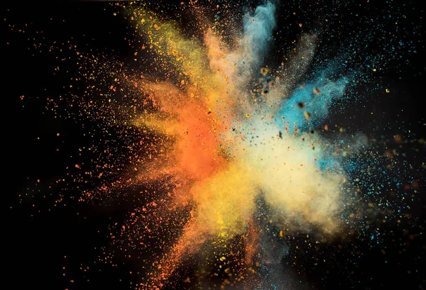 Launched colorful powder on black background — Stock Photo, Image