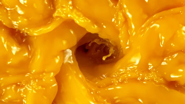 Freeze motion of pouring orange juice. Top view. — Stock Photo, Image