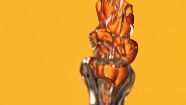 Super Slow Motion Shot of Oil Bubbles on Golden Background at 1000fps. — Stock Video