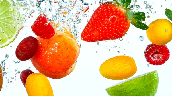 Freeze Motion Shot of Fresh Fruits falling into water — Stock Photo, Image