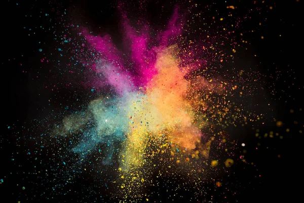 Colored powder explosion on black background. — Stock Photo, Image