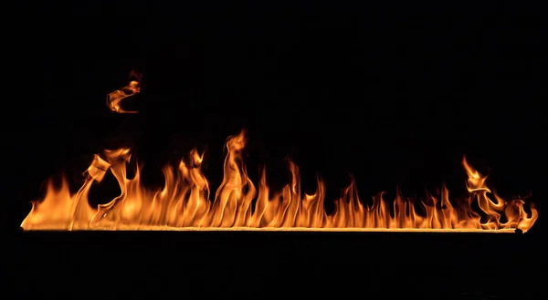 Chamas de fogo no fundo preto — Fotografia de Stock