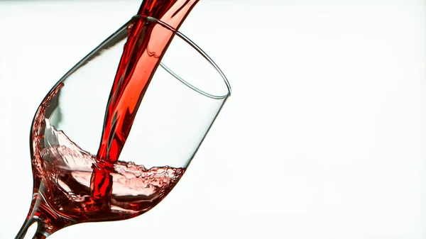 Red wine pouring into wine glass — Stock Photo, Image