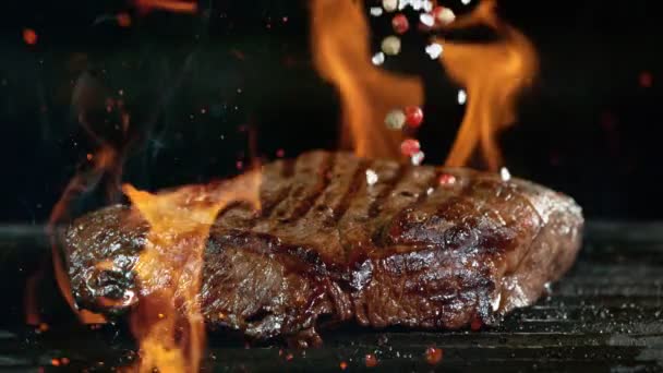 Close-up of falling tasty beef steak, slow motion. — Stok Video