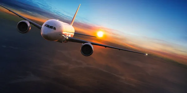 Commercial airplane jetliner flying above dramatic clouds. — Stock Photo, Image