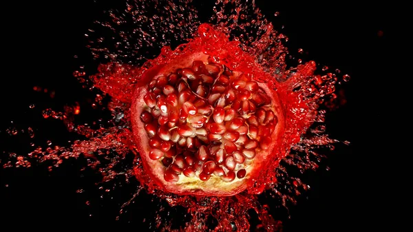 Freeze motion of sliced pomegranate with splashing juice. — Stock Photo, Image