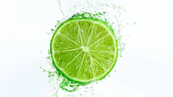 Fresh ripe lime with splashing juice — Stock Photo, Image