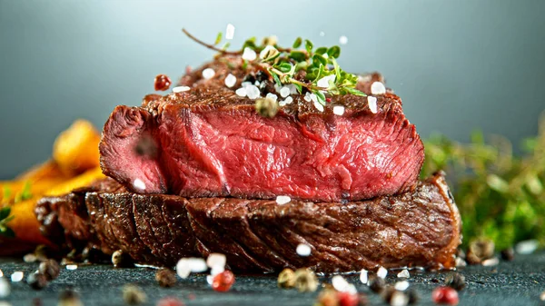 Close-up of tasty beef steak on stone table — Stock Photo, Image