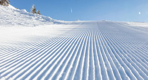Close-up straight line rows of ski slope piste — Stock Photo, Image