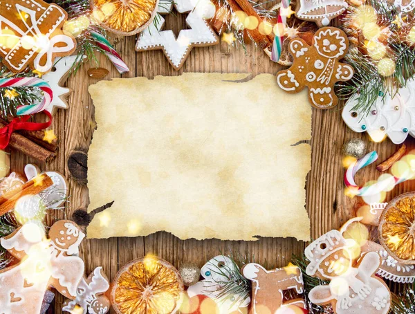 Christmas decoration with blank paper on wooden background — Stock Photo, Image