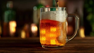 Super Slow Motion of Pouring Beer into Pint Glass, Camera Move. Filmed on High Speed Cinema Camera, 1000 fps.
