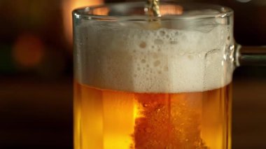 Super Slow Motion of Pouring Beer into Pint Glass, Camera Move. Filmed on High Speed Cinema Camera, 1000 fps.