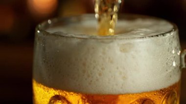 Super Slow Motion of Pouring Beer into Pint Glass, Camera Move. Filmed on High Speed Cinema Camera, 1000 fps.