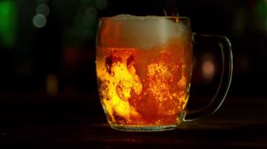 Super Slow Motion of Pouring Beer into Pint Glass, Camera Move. Filmed on High Speed Cinema Camera, 1000 fps.