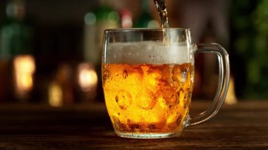 Super Slow Motion of Pouring Beer into Pint Glass, Camera Move. Filmed on High Speed Cinema Camera, 1000 fps.