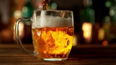 Super Slow Motion of Pouring Beer into Pint Glass, Camera Move. Filmed on High Speed Cinema Camera, 1000 fps.