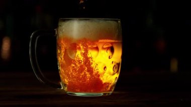 Super Slow Motion of Pouring Beer into Pint Glass, Camera Move. Filmed on High Speed Cinema Camera, 1000 fps.