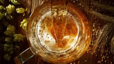 Super Slow Motion of Pouring Beer into Pint Glass, Top Down View. Filmed on High Speed Cinema Camera, 1000 fps.