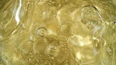 Super slow motion of champagne bubbles. Unique angle with underwater macro lens. Concept of celebration and success. Filmed on high speed cinema camera, 1000 fps