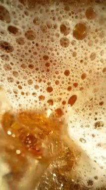 Super Slow Motion of Pouring Beer into Pint Glass, Top Down View. Filmed on High Speed Cinema Camera, 1000 fps.