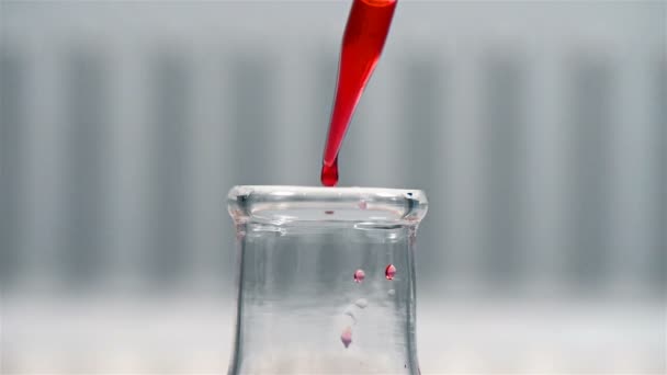 Pipette Dropping Red Sample Flask — Stock Video