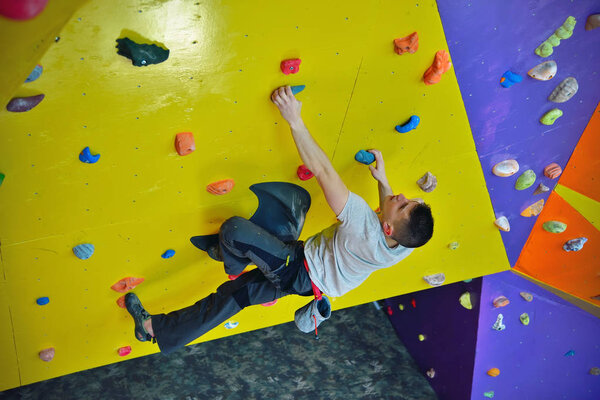 Man Climbing On Wall