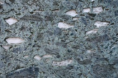 Taş doku, arka plan. Arka plan olarak kullanılan taşın yüzeyinin yapısı. Boş alan