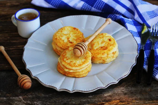 Stack of pancakes with honey syrup on wooden dark background. — Stock Photo, Image