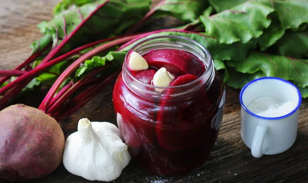 Pickled beets in the jar on a dark wood background — Stock Image Pickled beets in the jar on a dark wood background Stock Photo
