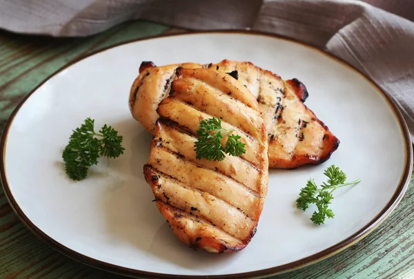 Grilled chicken breast on white plate — Stock Photo, Image