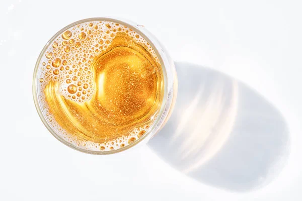 Glass of beer. Top view of lager beer or light beer on the white background.