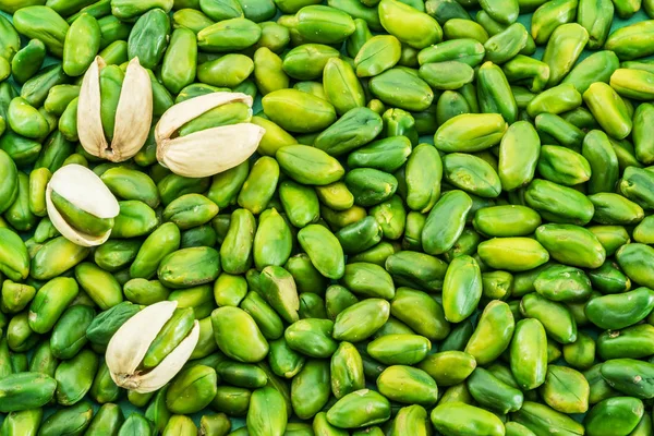 Viele Grüne Pistazienkerne Lebensmittel Hintergrund — Stockfoto