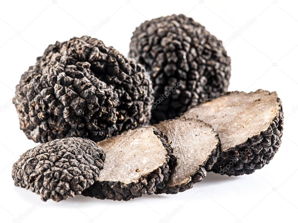 Black truffles isolated on a white background.