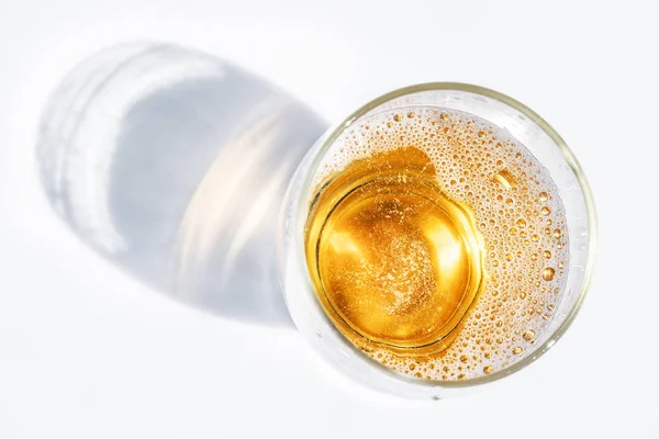 Glass of beer. Top view of lager beer or light beer on the white background.