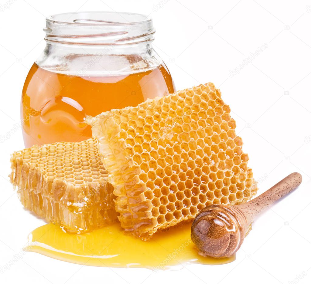 Jar full of fresh honey and honeycombs isolated on white background.