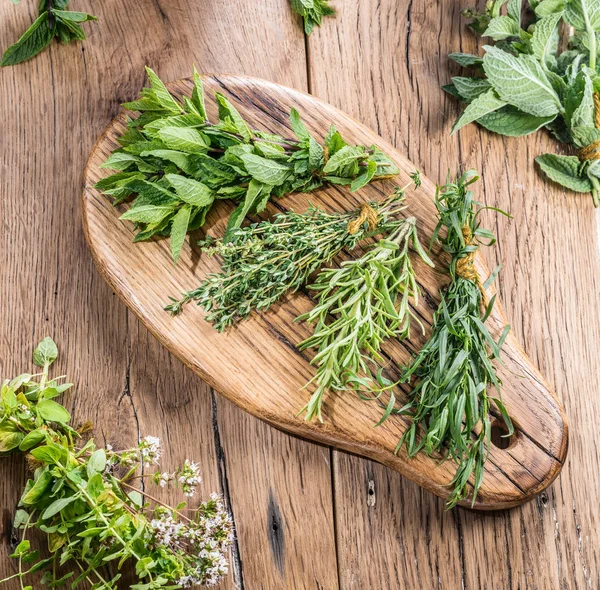 Different Bunches Fresh Herbs Wooden Table — Stock Photo, Image