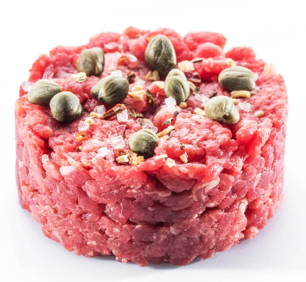 Raw minced meat or raw hamburger isolated on white background.