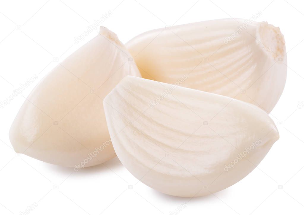 Three peeled garlic cloves. File contains clipping path. 