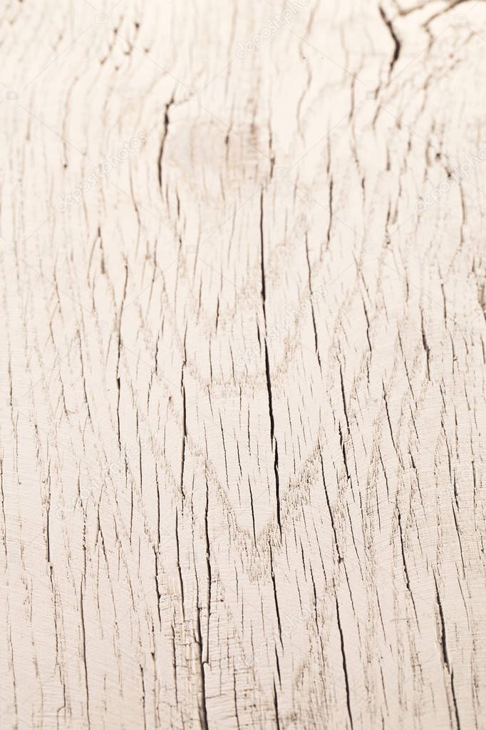 Texture of cracked wooden surface painted in white clolour.