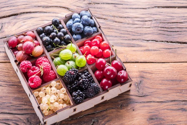 Colorful Berries Wooden Box Table Top View — Stock Photo, Image