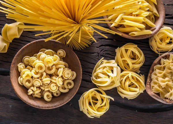 Different Pasta Types Wooden Table Top View — Stock Photo, Image