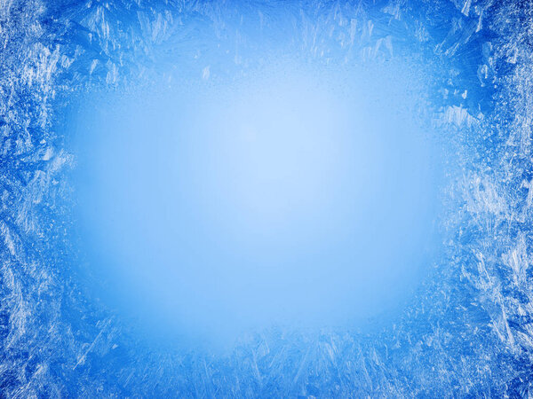 Frost patterns on frozen window as a symbol of Christmas wonder. Christmas or New year background.