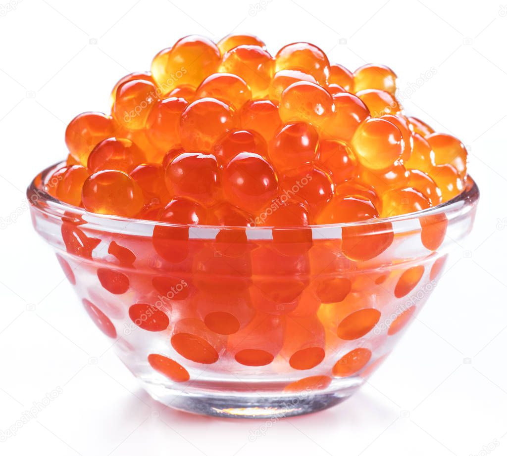Red caviar in the bowl on white background. Macro picture.
