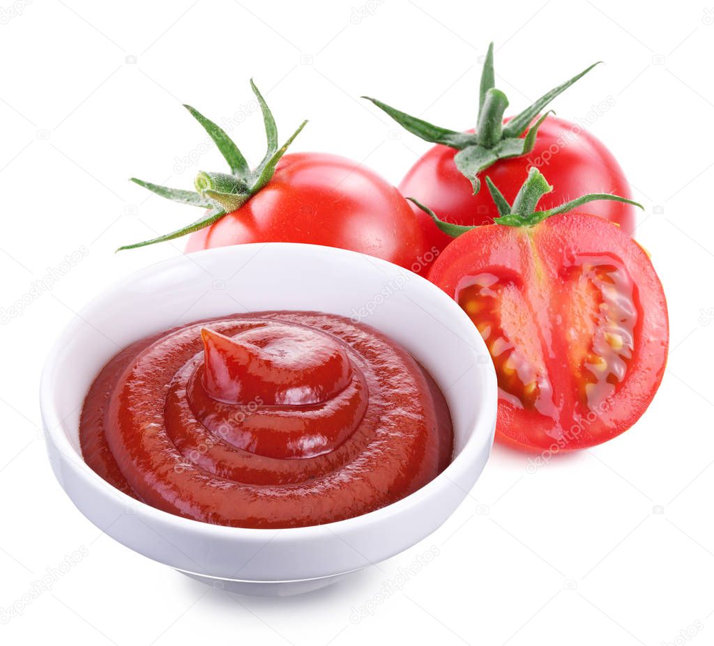 Bowl of ketchup sauce  and and red ripe tomatoes on white background. Close-up.