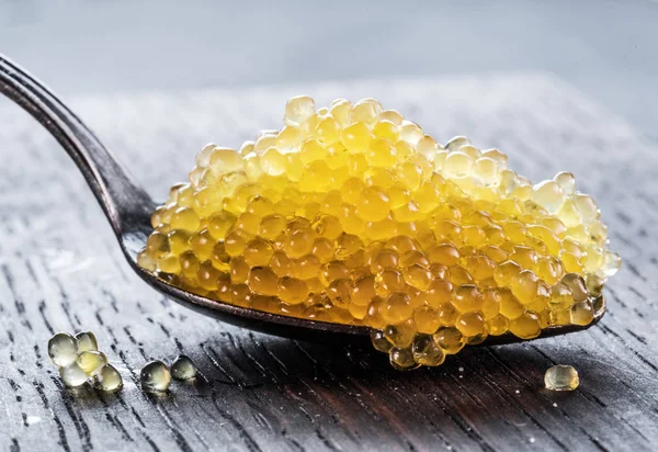 Pike caviar or roe in spoon on wooden background. Top view. — Stock Image Pike Caviar Roe Spoon Wooden Background Top View Royalty Free Stock Photos