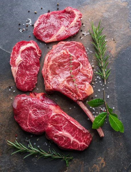 Raw Ribeye Steak Beef Steak Graphite Cutting Board Herbs Spices — Stock Photo, Image