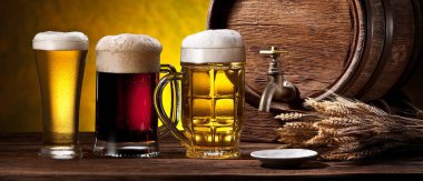 Glasses of beer and beer cask on the wooden table. Craft brewery clipart
