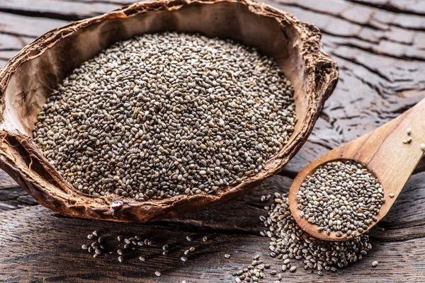Chia seeds in organic dish on old wooden table. Top view. — Stock Photo, Image